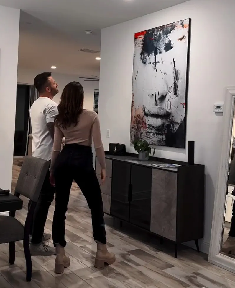 couple lookin at their abstract wall art