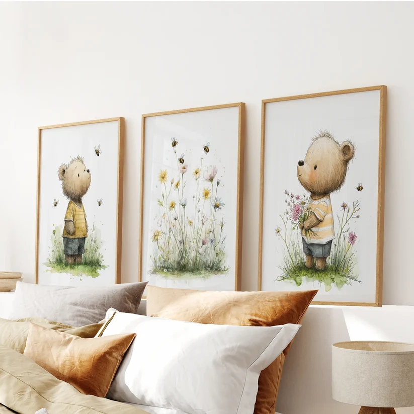 Three-piece floral baby animal nursery prints in black frames above a dresser