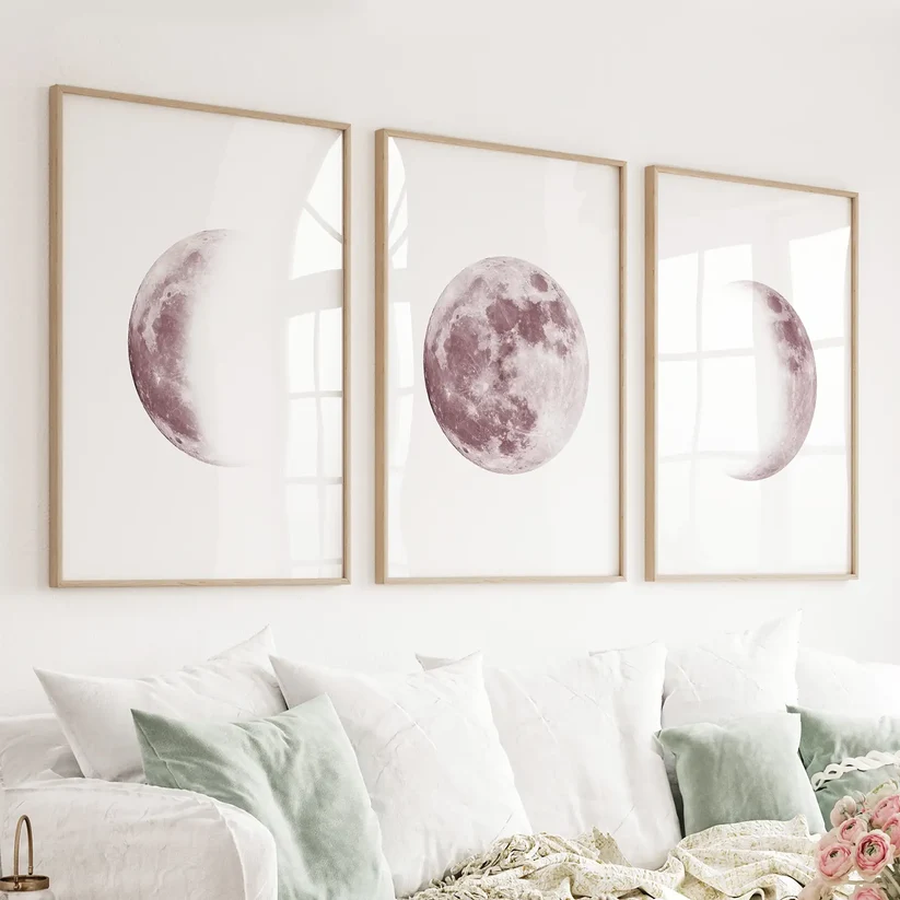 Three-piece blush pink moon phases wall art with white frames and mat